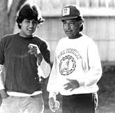 Cesar plays softball with his teenage son Paul.